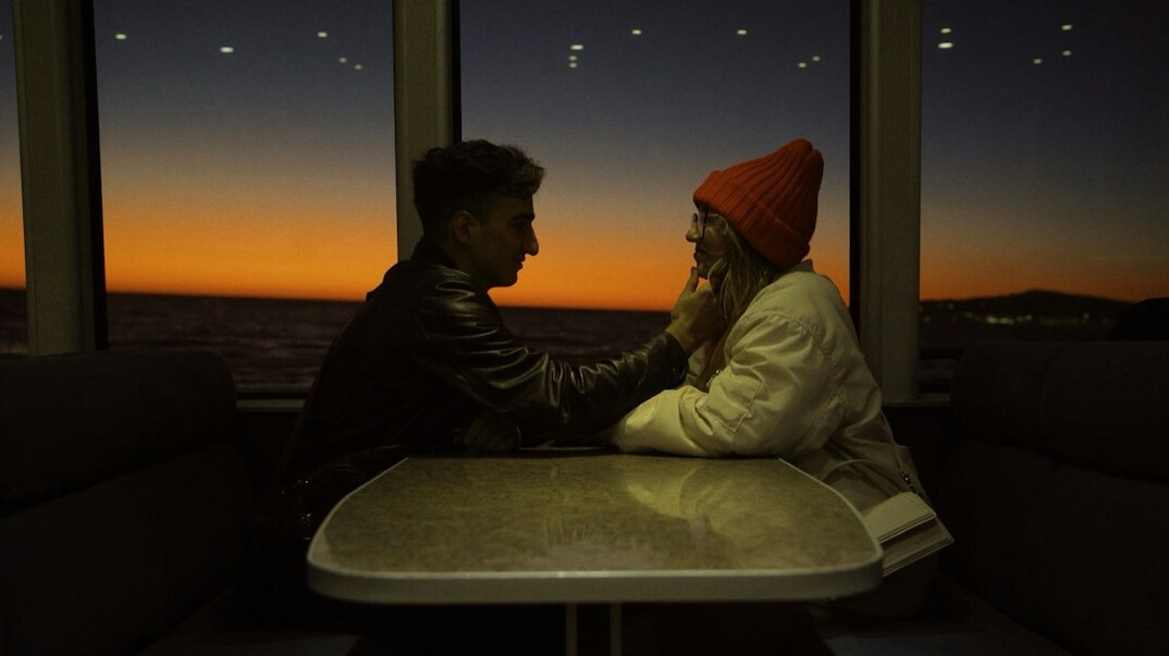 Two people having a conversation at a table