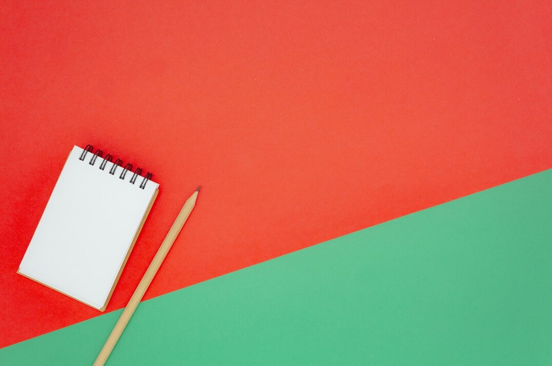 Notebook with a pen on a desk ready for notes